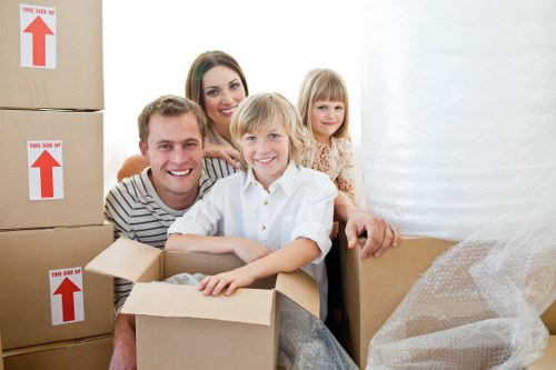 Removal team transporting furniture during a Stjohnswood flat move