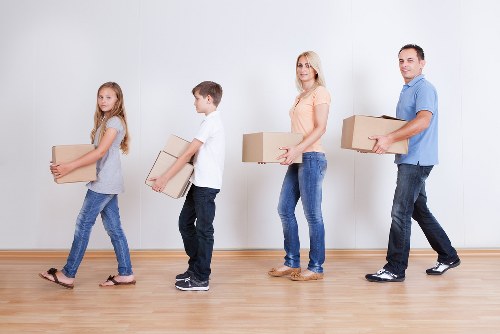 Packing boxes and furniture prepared for short-term storage in Stjohnswood