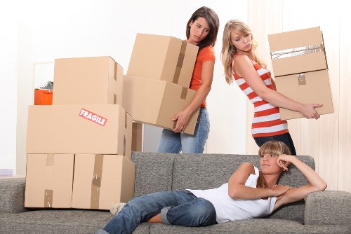 Employee wearing PPE while moving storage items