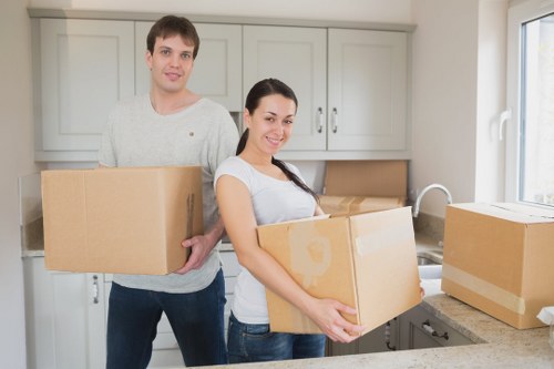 Professional movers handling furniture during a Stjohnswood relocation